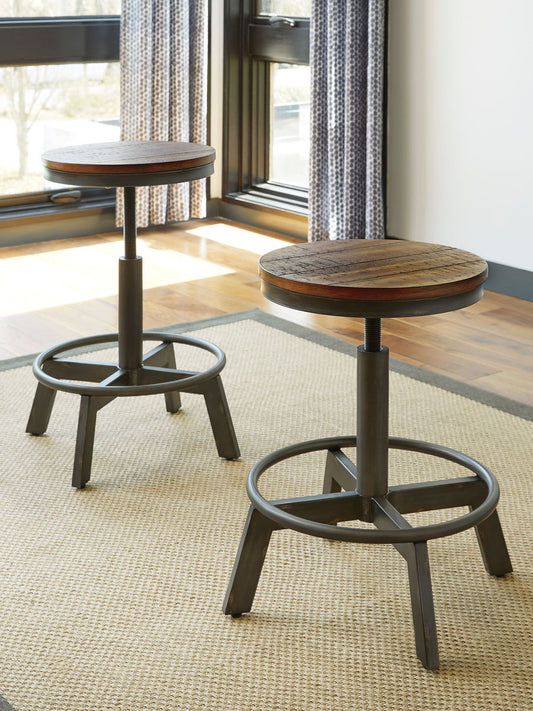 Torjin - 3 Pc. - Long Counter Table, 2 Stools - Dark Brown